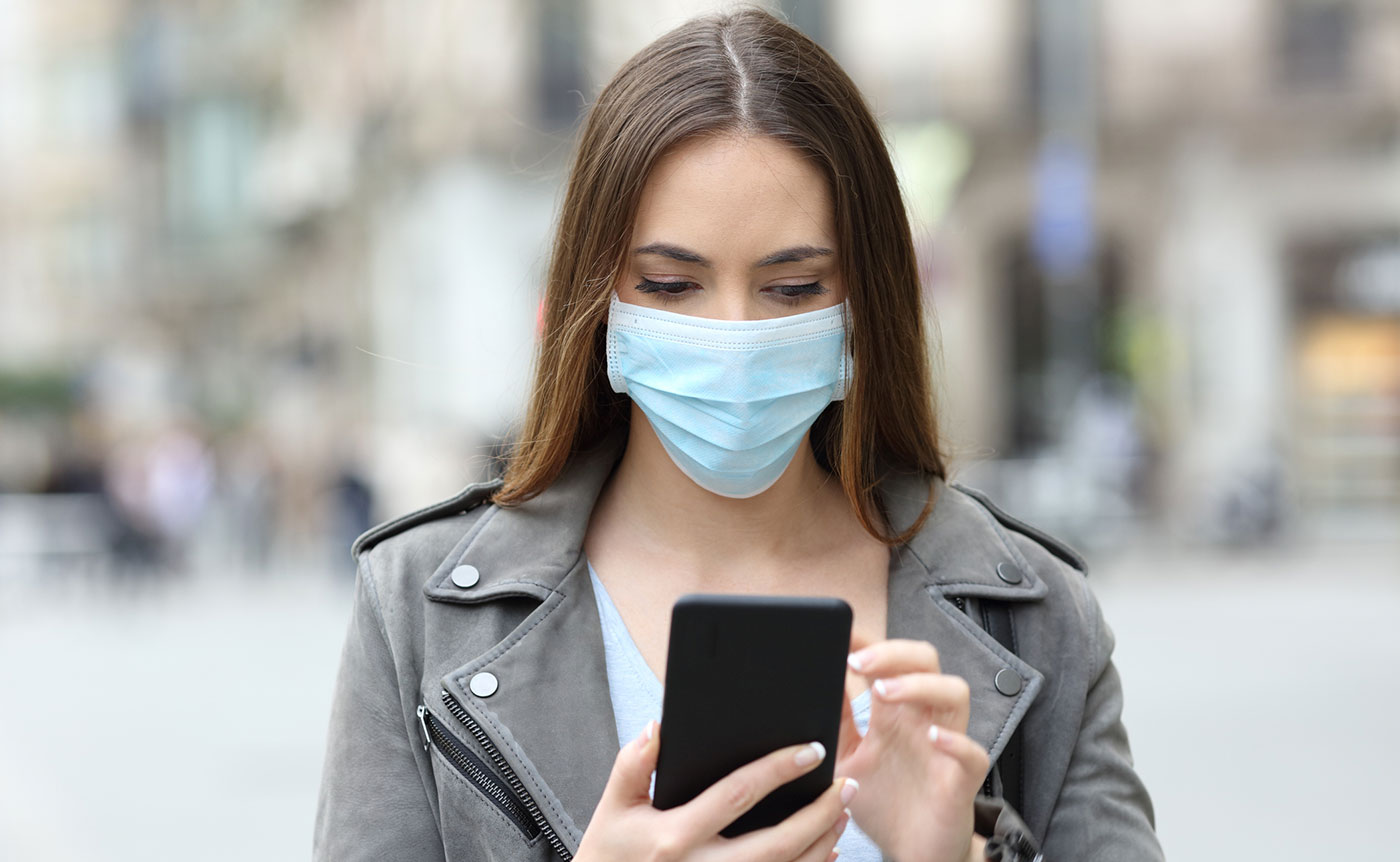 Woman on a cell phone, looking concerned