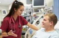 Doctor talking to a patient in a hospital bed