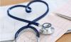 Stethoscope shaped like a heart sitting on some data readouts
