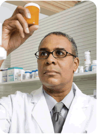 Photo of pharmacist holding a bottle of pills. Photo of pharmacist holding a bottle of pills.